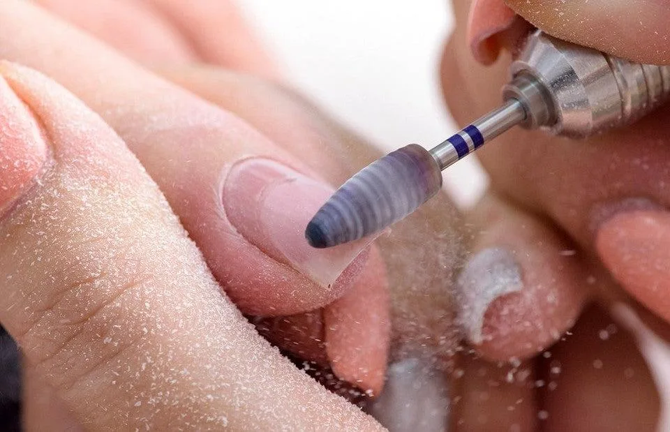 Delicate nail art being applied